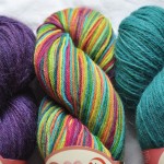 Misti Sock Yarn – (L-R) TF01 Purple Rain, HS56 Edible Brights, TF33 Bird  Soded. Loop, London. www.loopknitlounge.com