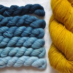 Pigeon Roof Mini Skeins in Denim and Uncommon Thread Tough Sock in Brassica. Loop, London. www.loopknitlounge.com