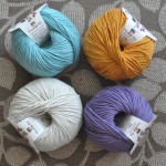 DMC Natura 4 Ply Cotton. CW from Top Left – 25 Aquamarine, 86 Brick, 88 Orleans, 03 Sable. Loop, London. www.loopknitlounge.com