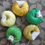 Rico – Cotton DK. CW from Top – 063 Banana, 45 Emerald, 61 Curry, 066 Grass Green, 062 Lemon. Loop, London. www.loopknitlounge.com