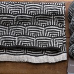 Conic by Lori Versaci in Woolfolk Tynd. Shown with Sno 1+15 Snow & Black. Loop, London