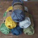Scheepjes Catona Cotton. CW from top, 242 Charcoal, 248 Champange, 395 Willow, 244 Spruce, 212 Sage Green, 249 Saffron. Loop, London www.loopknitlounge.com