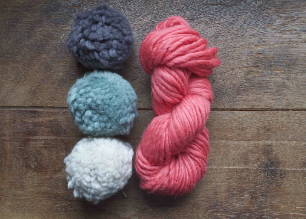 Mrs Moon Pompoms (Top-Bottom) Earl Grey, Sugared Almond, Pavlova and skein of Mrs Moon Plump in Rhubarb Crumble.