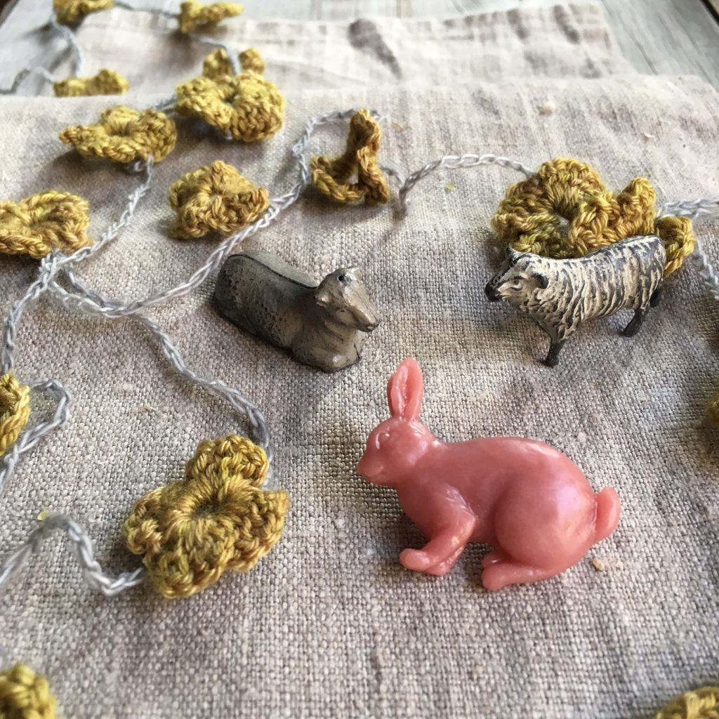 Resin bunny brooch, lead sheep and hand made flower garland at Loop London